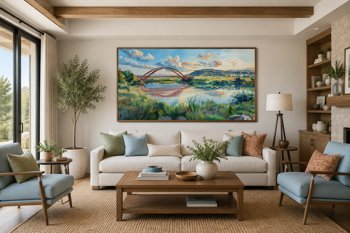 Pennybacker Bridge watercolor painting wall art above a sofa in a modern living room.