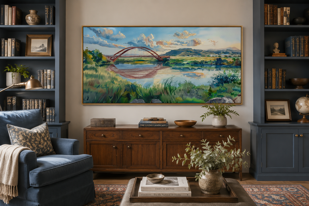Pennybacker Bridge watercolor painting wall art in a gold frame above a wooden sideboard.