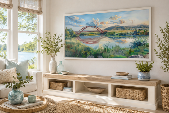 Pennybacker Bridge watercolor painting wall art in a white frame above a wooden console table.