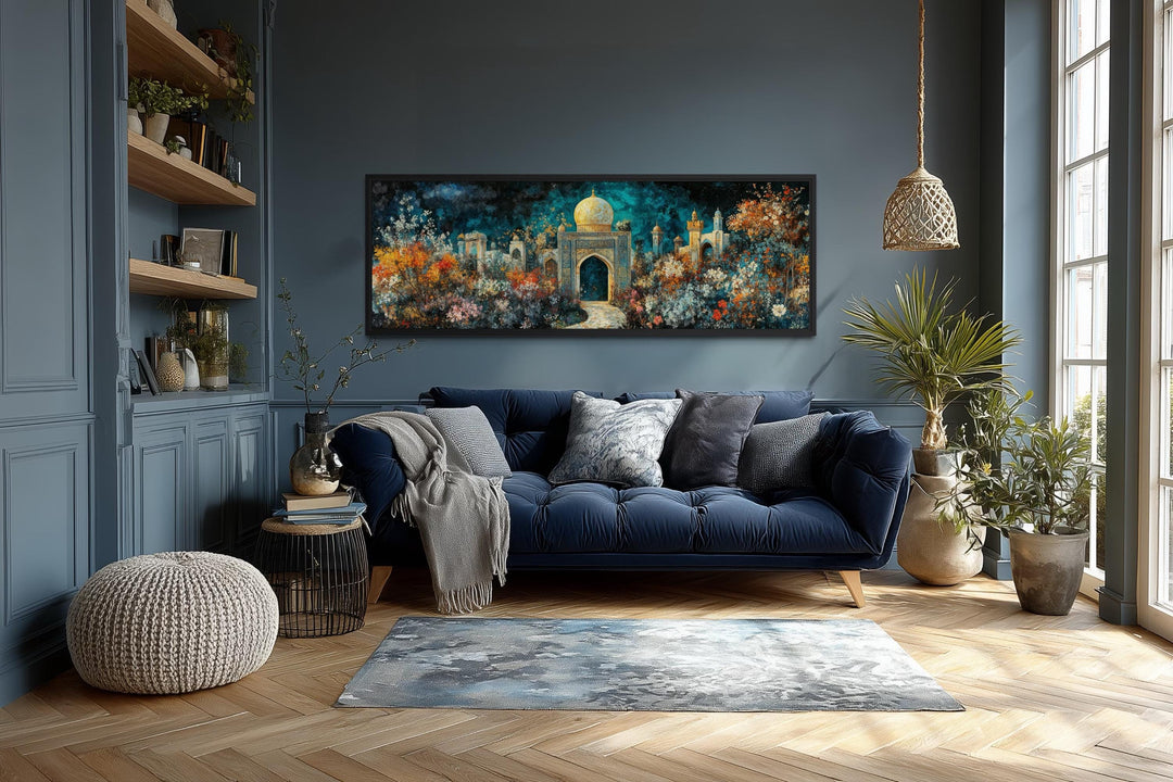 Panoramic Persian Teal Gold canvas art of a floral palace garden above a blue sofa in a living room.