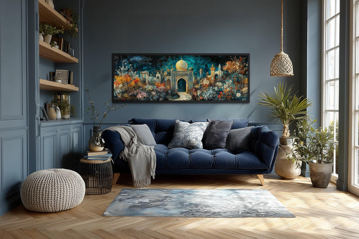 Panoramic Persian Teal Gold canvas art of a floral palace garden above a blue sofa in a living room.