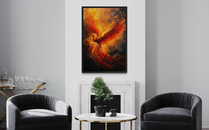 Vertical canvas wall art of a fiery phoenix rising, framed and hung above a modern fireplace.