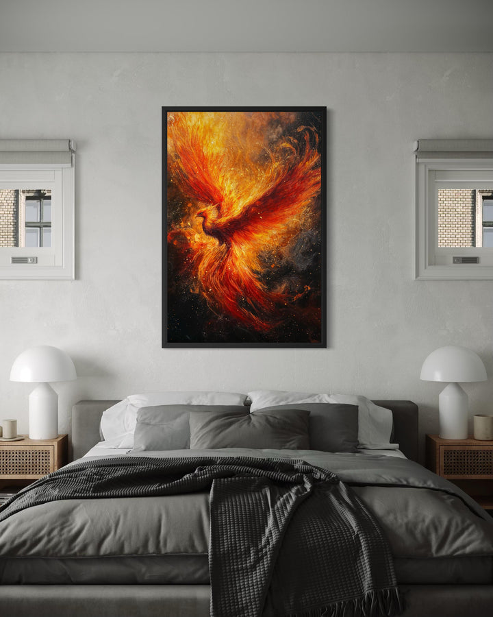 Vertical canvas wall art of a fiery phoenix rising, framed above a bed in a modern grey bedroom.