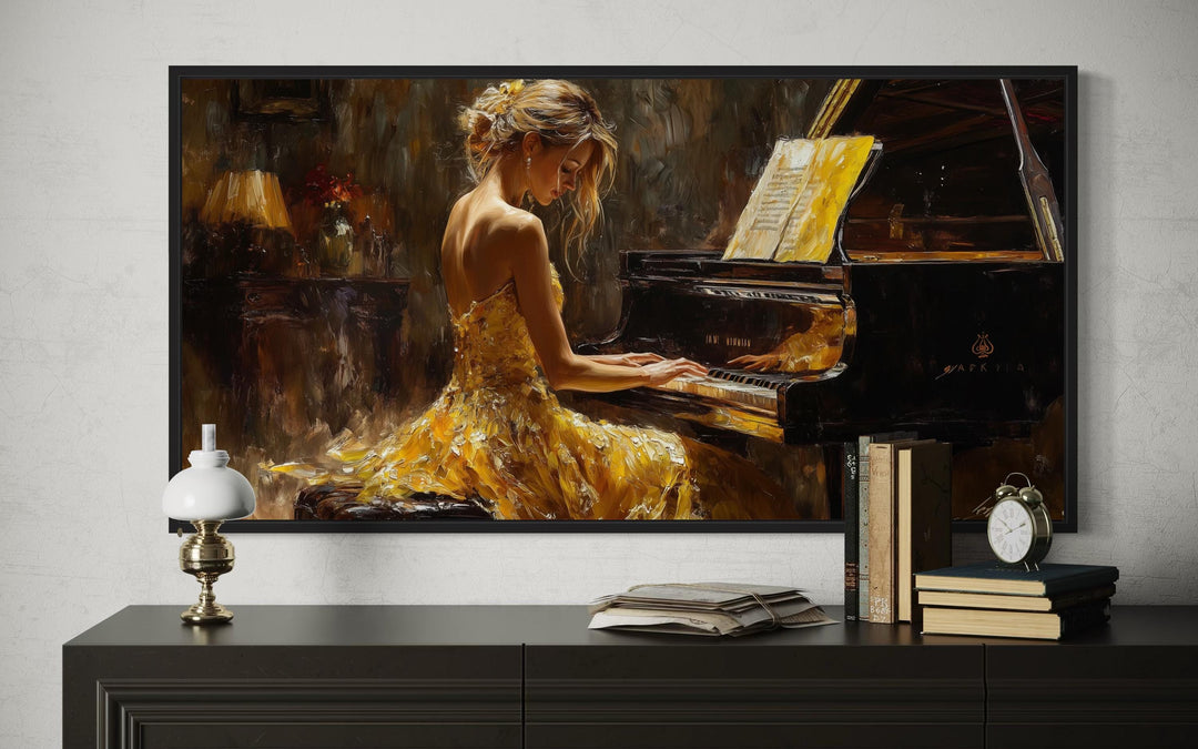 Framed canvas wall art of a woman in a yellow dress playing a grand piano in a moody room.