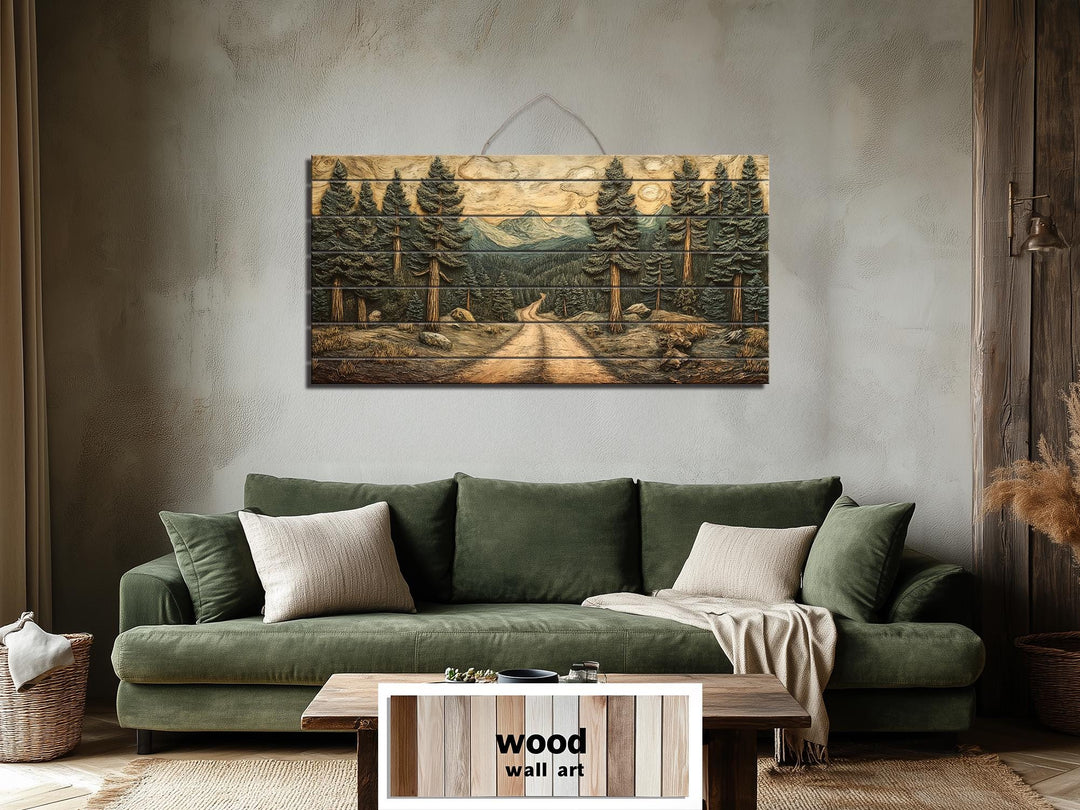 Pine forest landscape printed on a horizontal distressed wood wall art piece above a green sofa.