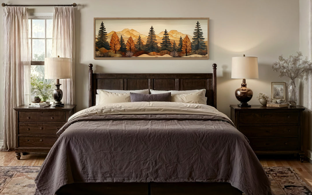 Long horizontal pine forest wood mosaic painting hanging above a dark wood bed in a rustic bedroom.