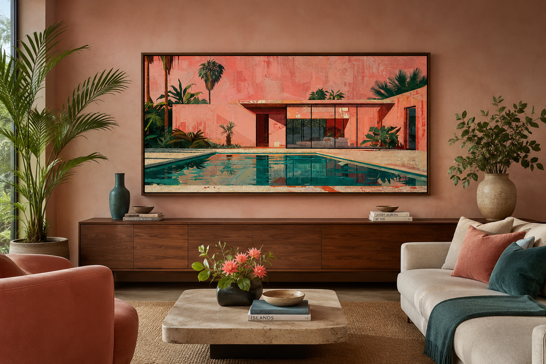 Framed pink and green mid-century modern house and pool architecture print on canvas above a console.