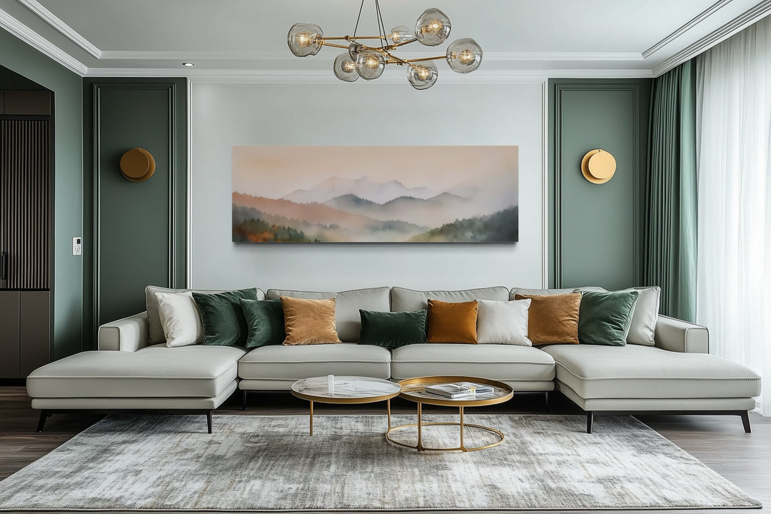 Pink and green pastel mountain landscape wall art displayed above a modern sofa in a living room.