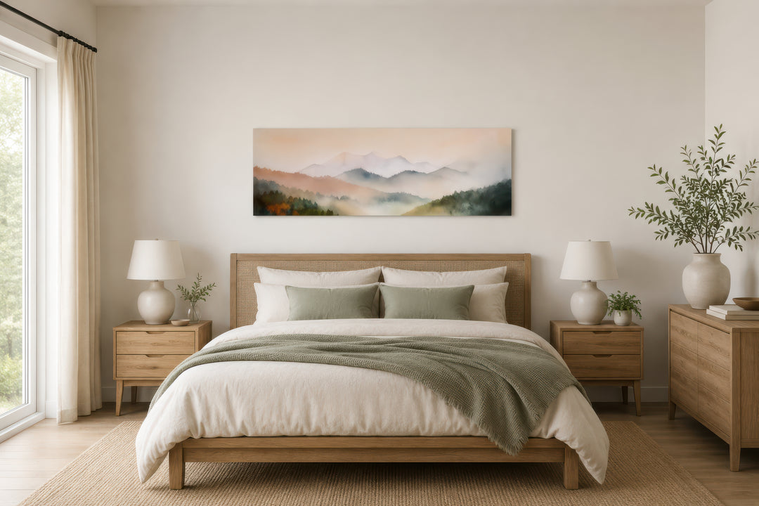 Pink and green pastel mountain landscape canvas print hanging above a wooden bed in a bedroom.