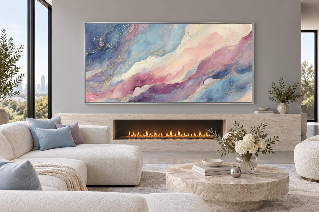 Pink and blue pastel abstract marble framed canvas wall art above a modern fireplace.