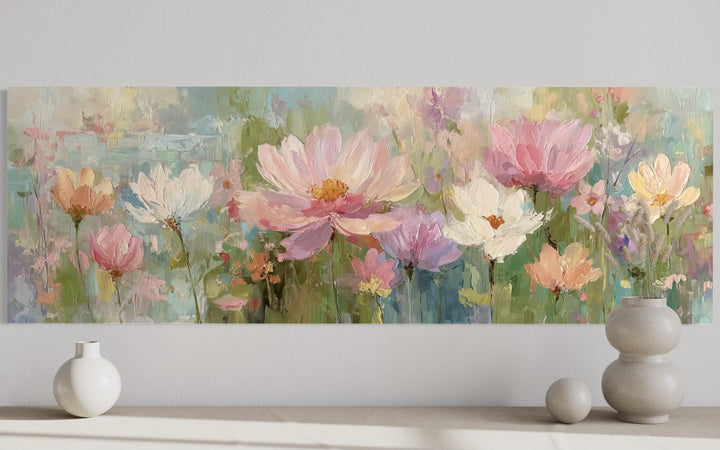 A long horizontal canvas painting of pink and white flowers in a soft, impressionistic style.