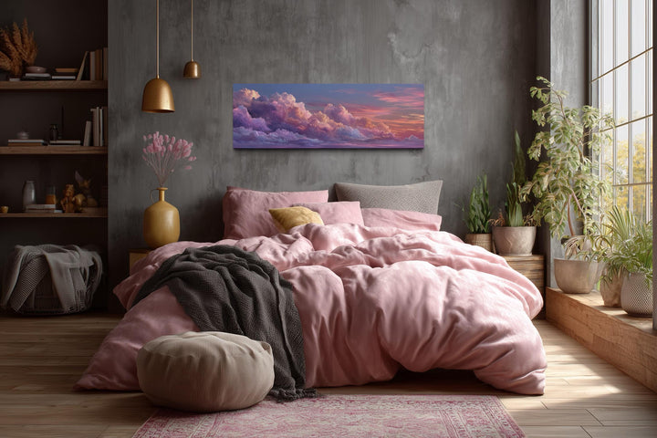 Panoramic canvas wall art featuring a dreamy pink and purple sunset sky with fluffy clouds.