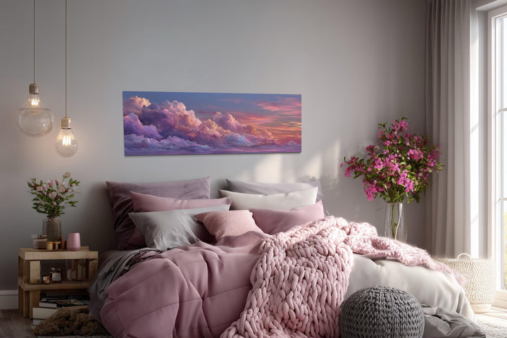 Panoramic canvas wall art featuring a dreamy pink and purple cloud sunset over a cozy bedroom.