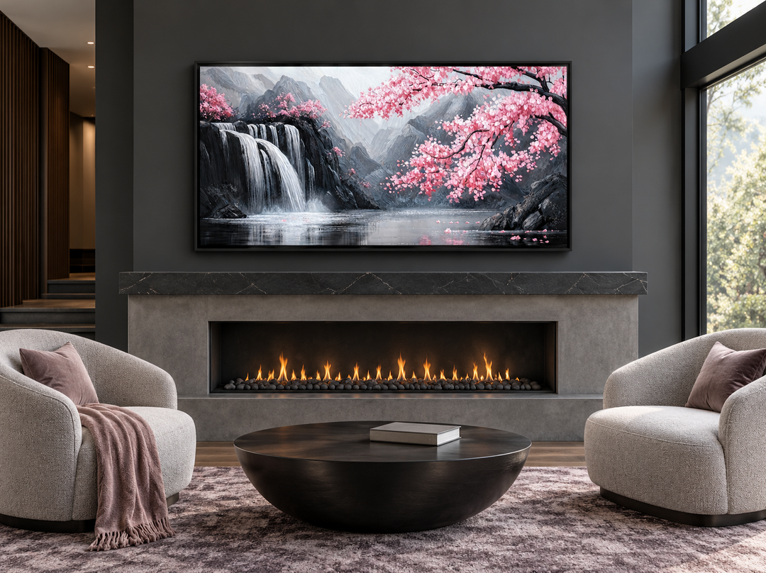 Pink cherry blossom and grey waterfall framed canvas wall art mounted above a modern fireplace.