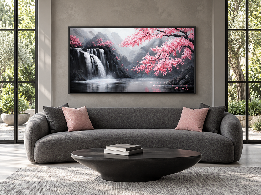Pink cherry blossom and grey waterfall framed canvas wall art above a grey sofa in a modern room.