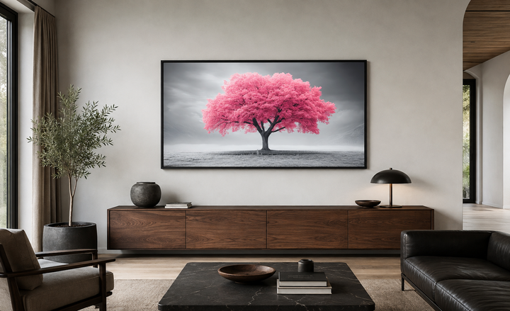 Extra large framed canvas wall art of a vibrant pink tree on a black and white landscape background.