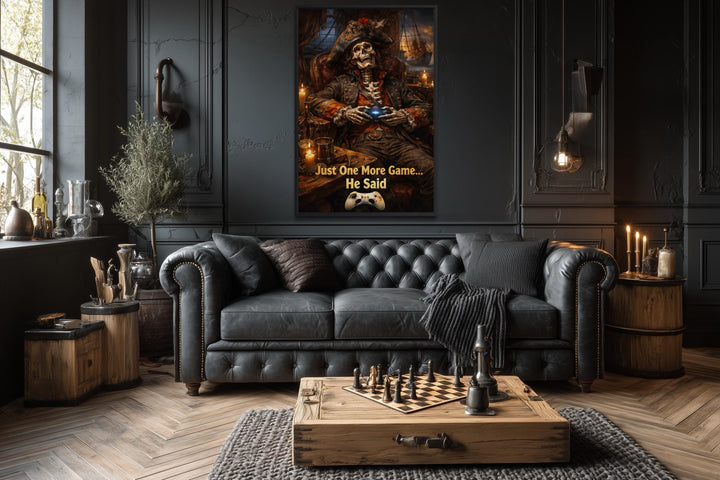 A framed canvas of a pirate skeleton gaming, titled Just One More Game, in a dark, gothic room.