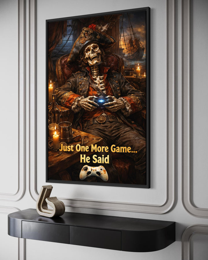 Framed canvas art of a pirate skeleton gaming with the quote Just One More Game... He Said.