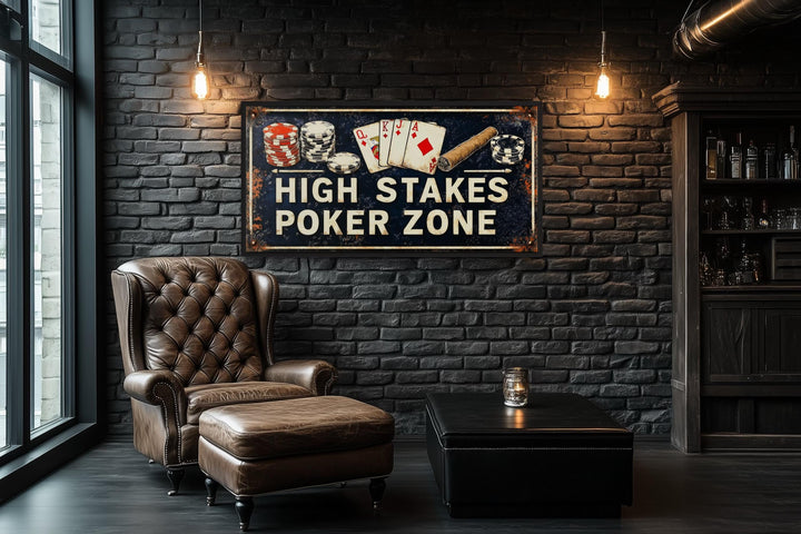 High Stakes Poker Zone vintage sign on a black brick wall above a leather chair and ottoman.