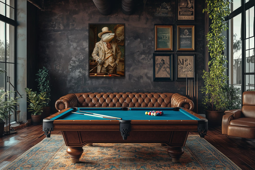 Framed canvas wall art of a shark in a suit hanging in a billiards room with a pool table and sofa.