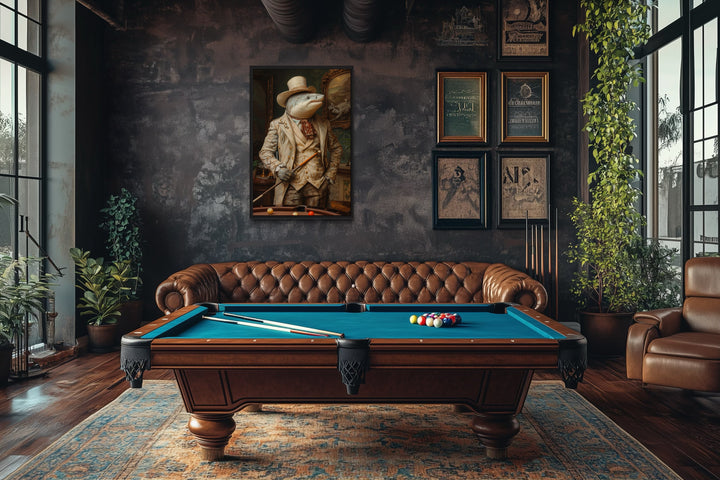 Framed canvas wall art of a shark in a suit hanging in a billiards room with a pool table and sofa.