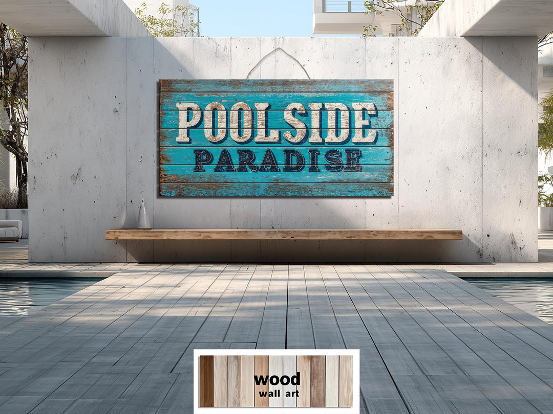 Rustic Poolside Paradise distressed wood wall art sign hanging on a modern concrete patio wall.