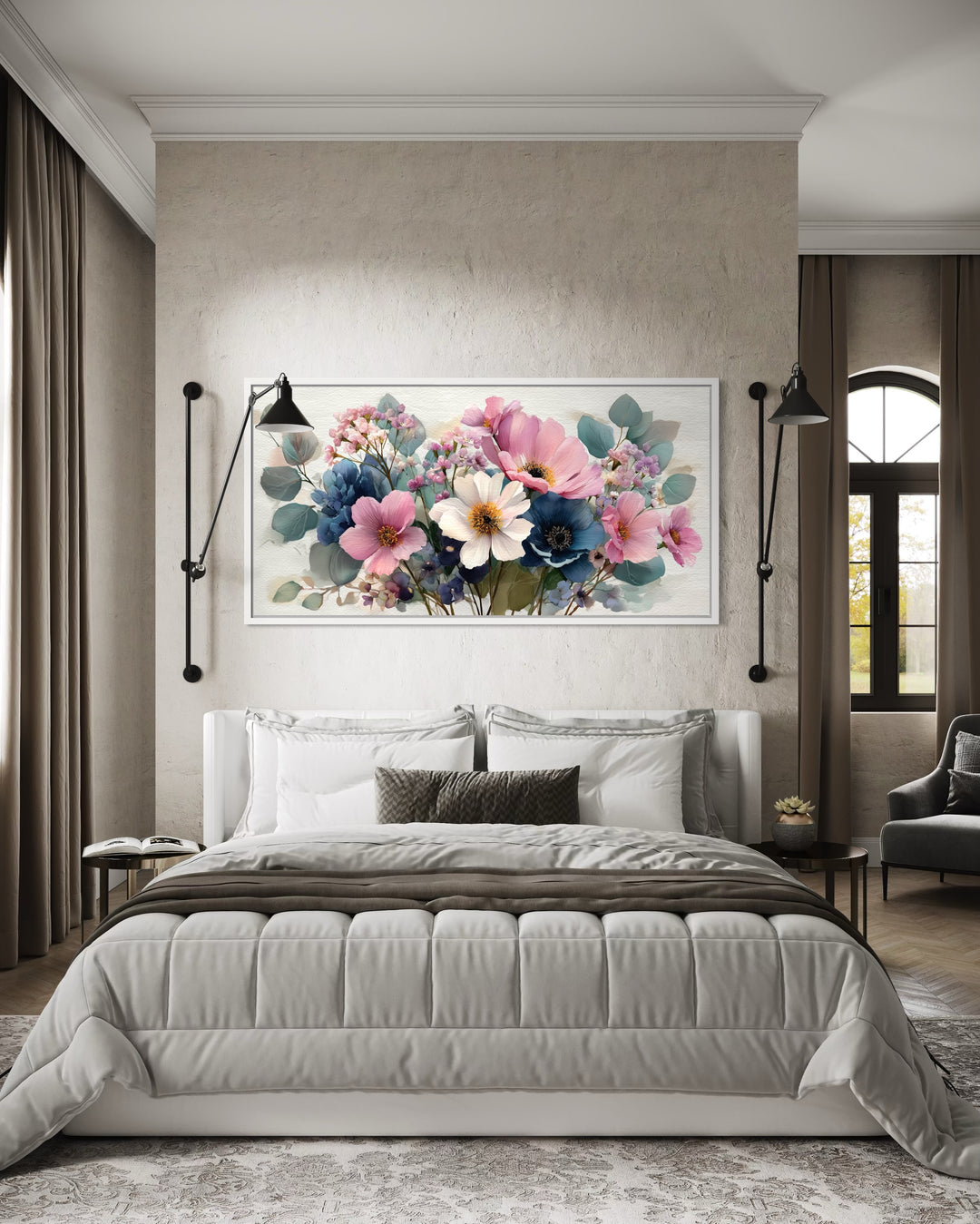 Pretty blue and pink wildflower bouquet framed canvas wall art hanging above a bed in a bedroom.