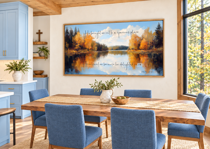 Psalm 18:19 scripture canvas art featuring an autumn lake landscape in a modern dining room.