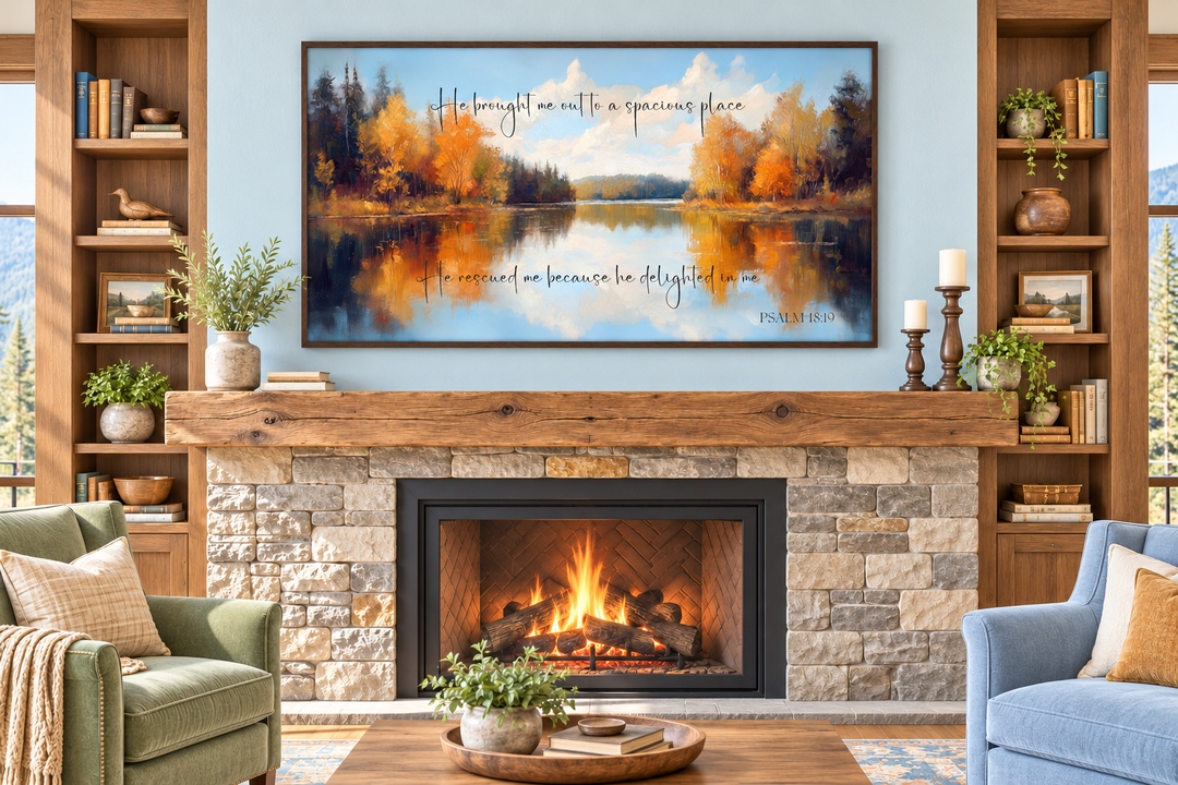 Psalm 18:19 canvas art featuring an autumn lake painting above a stone fireplace in a cozy room.