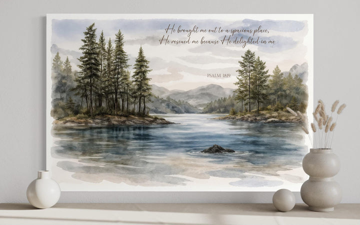 Watercolor lake landscape canvas print with Psalm 18:19 scripture and evergreen trees.