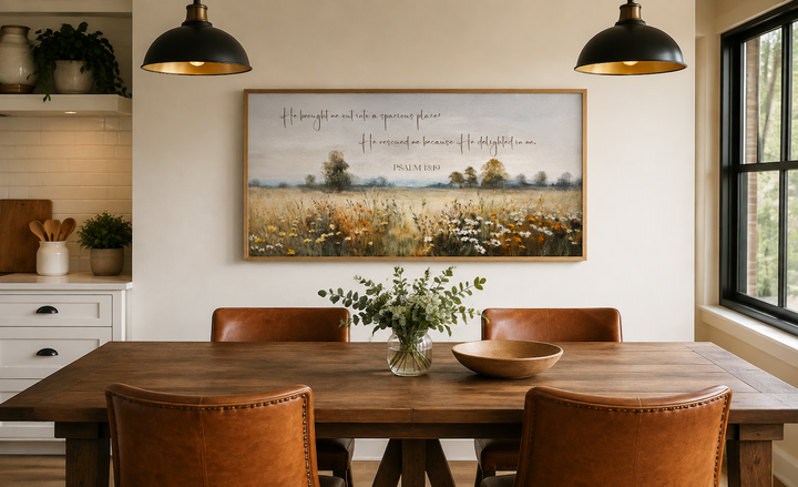 Psalm 18:19 scripture wall art featuring a wildflower field painting in a dining room setting.