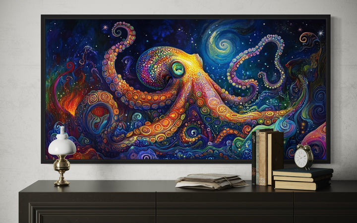 Psychedelic Octopus framed canvas wall art above a dark wood dresser with books and a lamp.