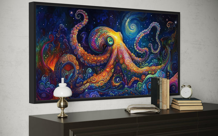 Psychedelic octopus framed canvas wall art with vibrant colors on a dark dresser in a modern room.
