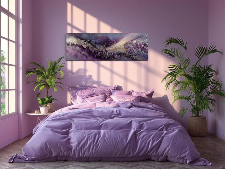 Purple abstract amethyst fluid landscape canvas print with gold accents above a bed.