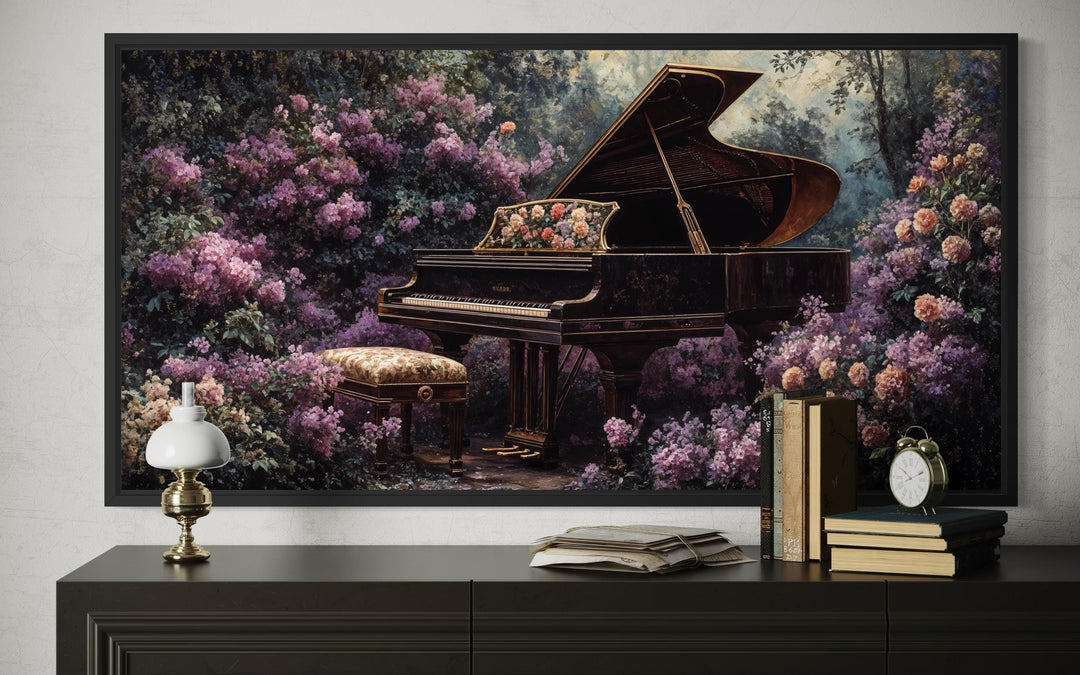 Framed wall art of a grand piano surrounded by lush purple flowers above a dark console table.