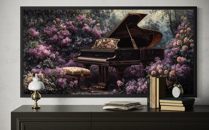 Framed wall art of a grand piano surrounded by lush purple flowers above a dark console table.