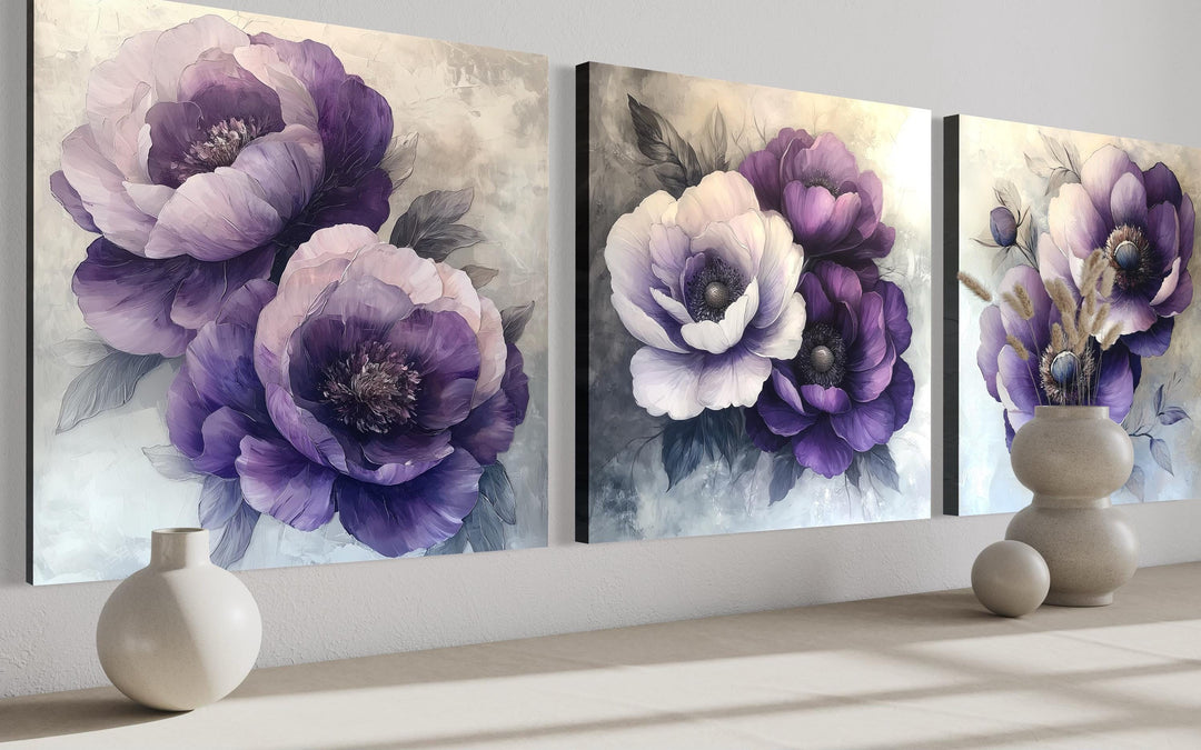 Set of three purple floral canvas prints with modern botanical blooms in violet and lilac shades.