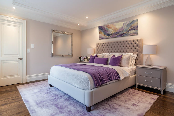 Purple and gold marble abstract framed canvas wall art displayed above a tufted headboard.