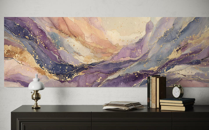 A long horizontal abstract canvas with flowing purple, gold, and cream marble patterns.
