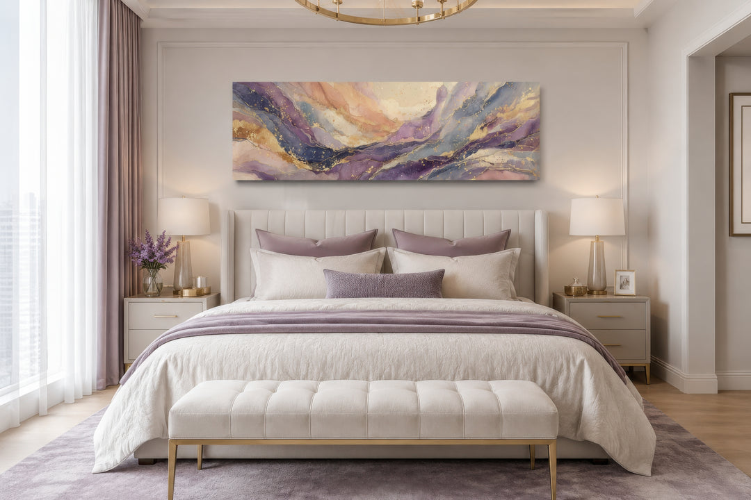 Long horizontal abstract framed canvas wall art with purple and gold marble patterns over a bed.