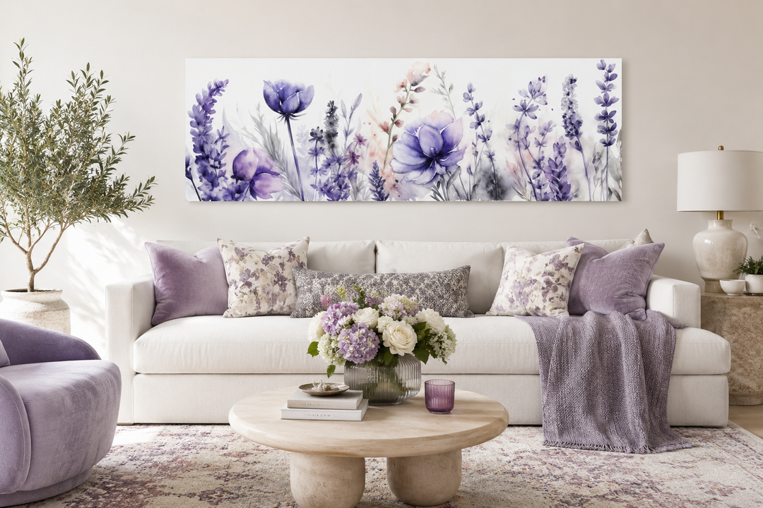 Panoramic framed canvas wall art featuring purple lavender wildflowers above a white sofa.