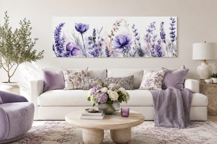 Panoramic framed canvas wall art featuring purple lavender wildflowers above a white sofa.