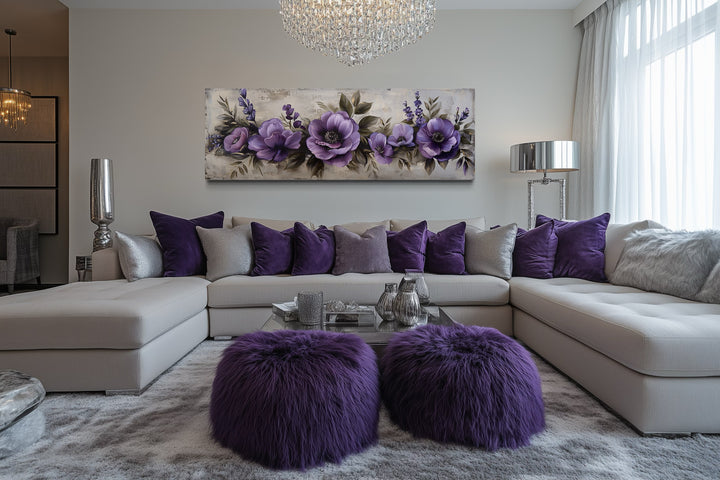 Panoramic framed canvas wall art featuring antique purple flowers above a modern living room sofa.
