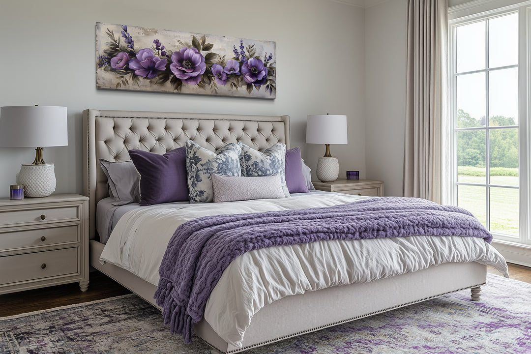 Panoramic framed canvas wall art featuring antique purple flowers displayed above a bed.