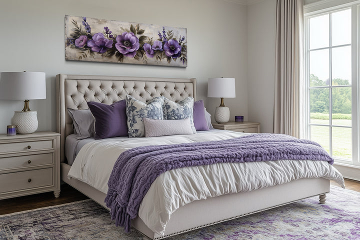 Panoramic framed canvas wall art featuring antique purple flowers displayed above a bed.