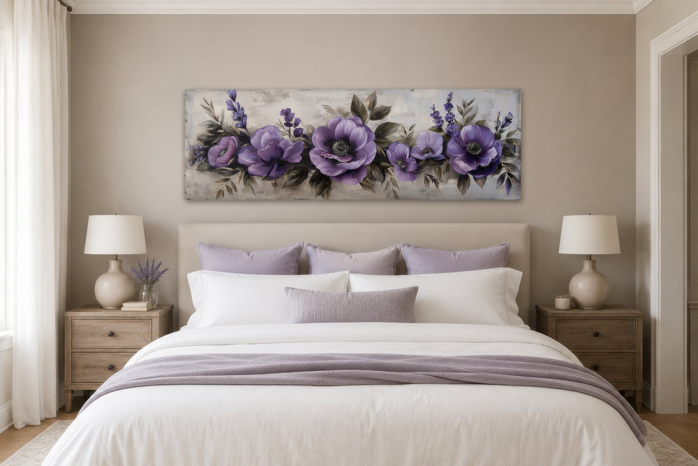 Panoramic framed canvas wall art featuring purple antique flowers hanging above a bed.