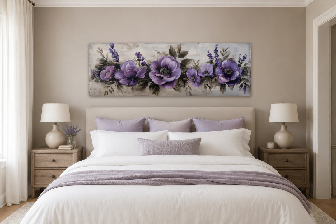 Panoramic framed canvas wall art featuring purple antique flowers hanging above a bed.