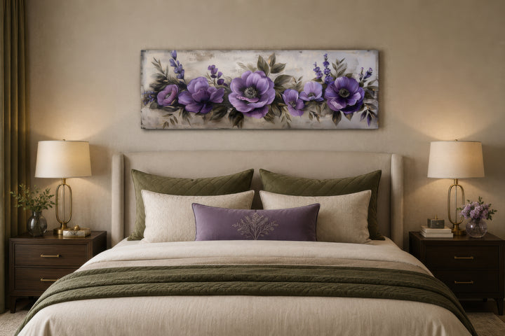 Panoramic framed canvas wall art featuring antique purple flowers displayed above a bed.