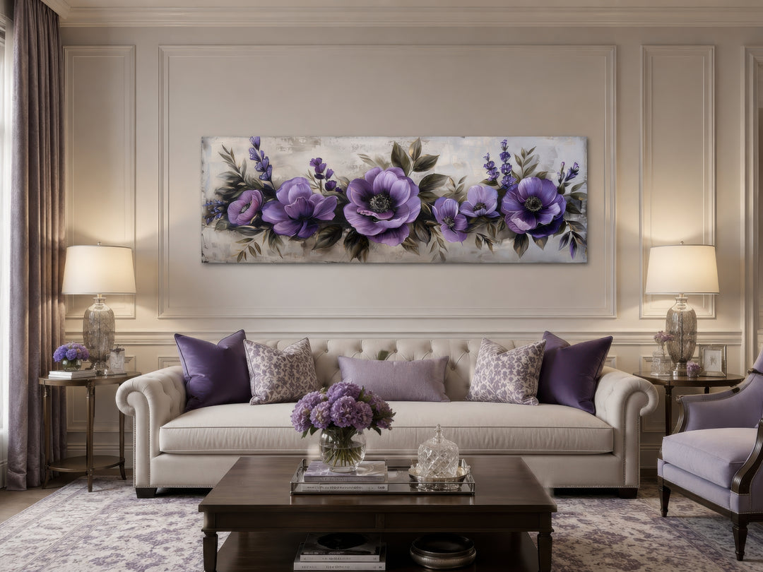 Panoramic framed canvas wall art featuring antique purple and lavender flowers above a sofa.