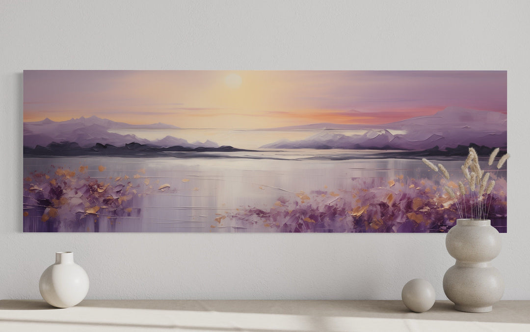 Long horizontal painting of a purple mountain lake sunset with textured gold and lavender details.